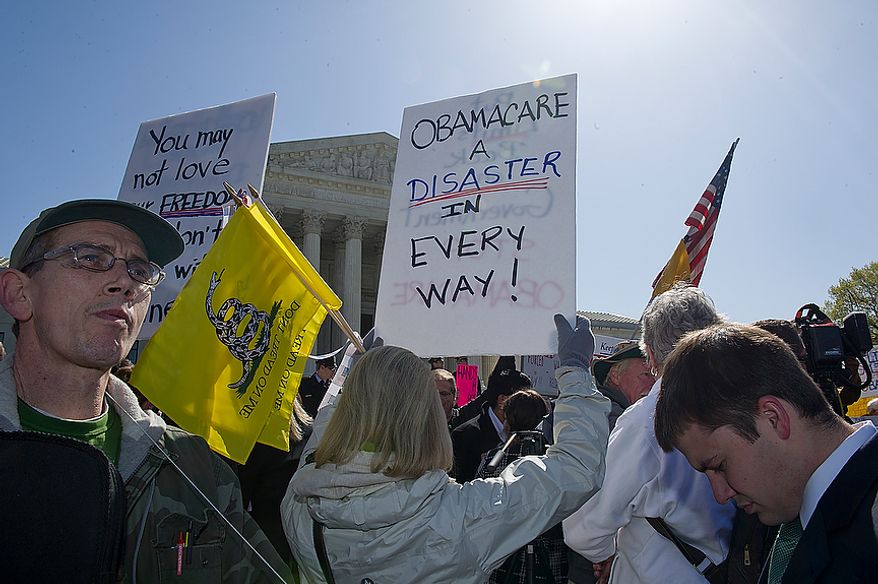 Clayton Bink, left, of South Edmefton, N.Y., says that he came to Washington, D.C. because the federal government is vastly overstepping its Constitutional authority with the individual mandate that exists in the Affordable Care Act. He joined hundreds of other protesters on both sides of the issue outside of the Supreme Court on Tuesday, March 27, 2012, while the court listened to oral arguments. (Barbara L. Salisbury/The Washington Times)