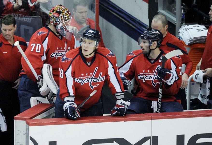 Washington goalie Braden Holtby (70) leaves the ice Tuesday after falling behind 3-0 in a game Buffalo went on to win 5-1. The Sabres overtook the Capitals in the race for the eighth and final Eastern Conference playoff spot. (Associted Press)