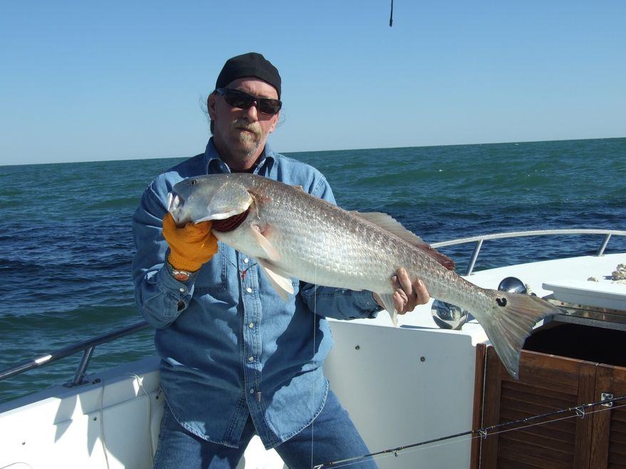 This undated photo provided by Ashley Coen shows her father, Ed Coen, during a fishing trip. Ed Coen died after he and friend Ken Henderson's boat sank in the Gulf of Mexico. (AP Photo/Ashley Coen via Conroe Courier)