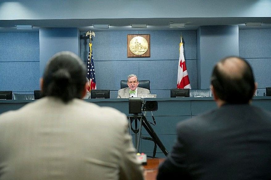 D.C. Council member Jim Graham, Ward 1 Democrat, listens to testimony Thursday on the mayor's proposal to extend night-life hours. Mr. Graham opposes the one-hour extension. (Barbara L. Salisbury/The Washington Times)