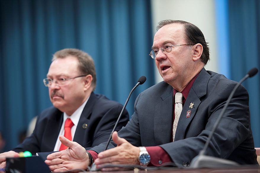 Skip Coburn (right), executive director of the D.C. Nightlife Association, urges a D.C. Council committee during a hearing Thursday to consider extending hours that bars and restaurants can serve alcohol. "We have a 24-hour city, we have a 24-hour world," he says. Mayor Vincent C. Gray has proposed the change. (Barbara L. Salisbury/The Washington Times)