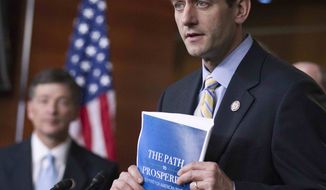 **FILE** House Budget Chairman Rep. Paul Ryan (right), Wisconsin Republican, with Republican Conference Chairman Rep. Jeb Hensarling of Texas, holds a copy of their budget proposal during a news conference March 29, 2012, on Capitol Hill. (Associated Press)