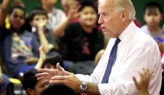 Vice President Joseph R. Biden Jr., talks March 28, 2012, to students during his stop at the Boys Club in Sioux City, Iowa. (Associated Press/Sioux City Journal)
