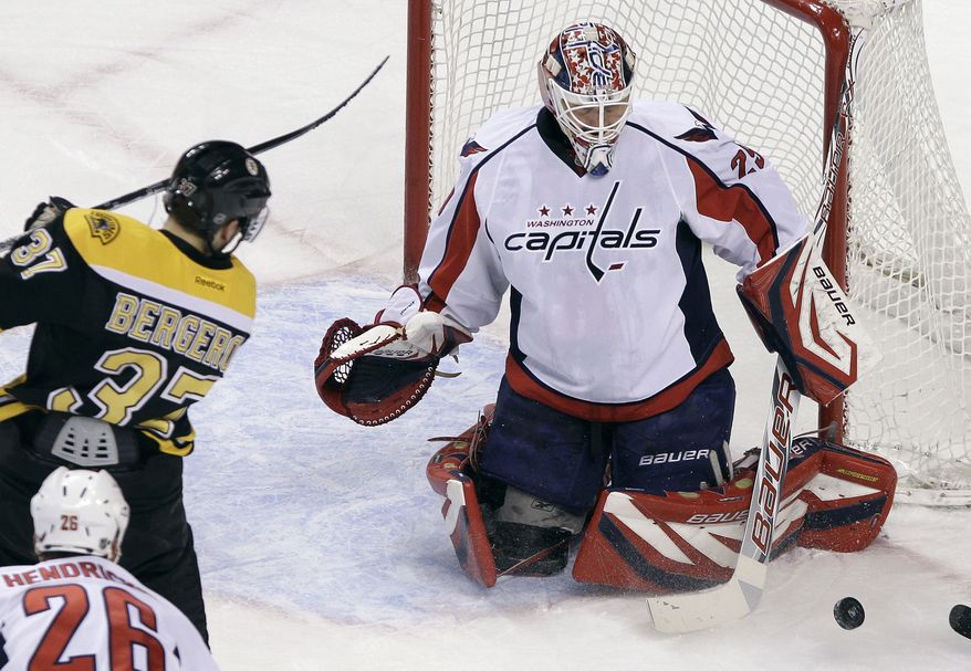 Washington Capitals goalie Tomas Vokoun left the game late in the first period with a groin injury. He was replaced by Michal Neuvirth, who made 19 saves in the 3-2 shootout win over the Bruins. (AP Photo/Elise Amendola)