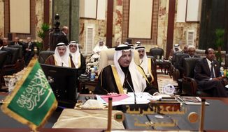 Ahmad al-Qattan (center), Saudi Arabia&#39;s permanent representative to the League of Arab States, attends the annual Arab League summit in Baghdad on March, 29, 2012. (Associated Press)