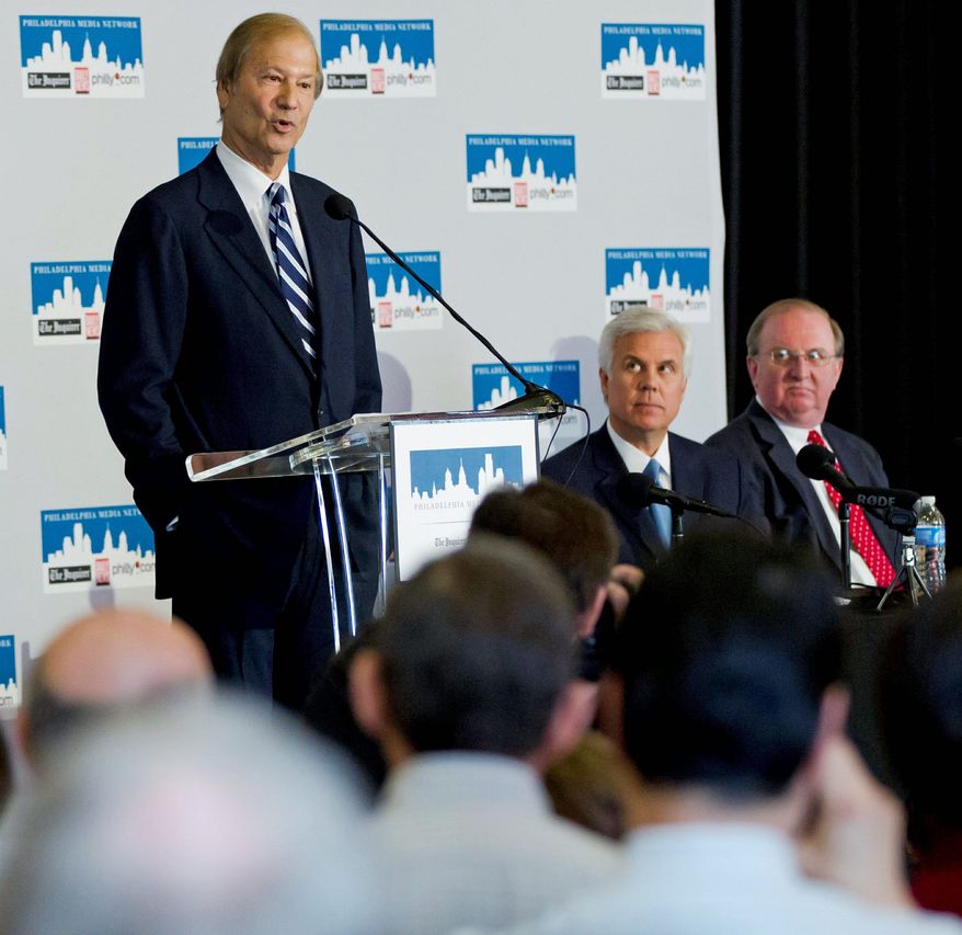 Lewis Katz, left, addresses a news conference while accompanied by William P. Hankowsky, right, and George Norcross III, Monday, April 2, 2012, in Philadelphia. The three are part of group of powerful business leaders that announced Monday that they have closed a deal to purchase Philadelphia's two largest newspapers from hedge funds for approximately $55 million, a fraction of what investors paid for them in 2006.(AP Photo/Matt Rourke)