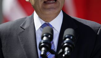 Mexican President Felipe Calderon speaks April 2, 2102, during a joint news conference with President Obama and Canadian Prime Minister Stephen Harper in the Rose Garden of the White House. (Associated Press)