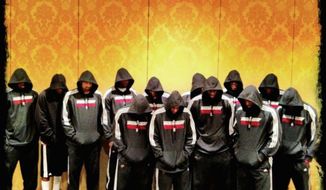 In March 2012, then-Miami Heat star LeBron James tweeted this photo of him and his teammates donning hoodies for a team photo as a tribute to Trayvon Martin, the Florida youth slain a month earlier. (Associated Press)
