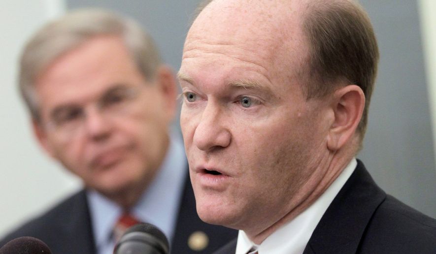 Rep. Chris Coons, Delaware Democrat, accompanied by Sen. Robert Menendez, New Jersey democrat, talks about the Palestinian effort to seek U.N. recognition of statehood, Tuesday, Sept. 20, 2011, during a news conference on Capitol Hill in Washington. (AP Photo/J. Scott Applewhite) **FILE**