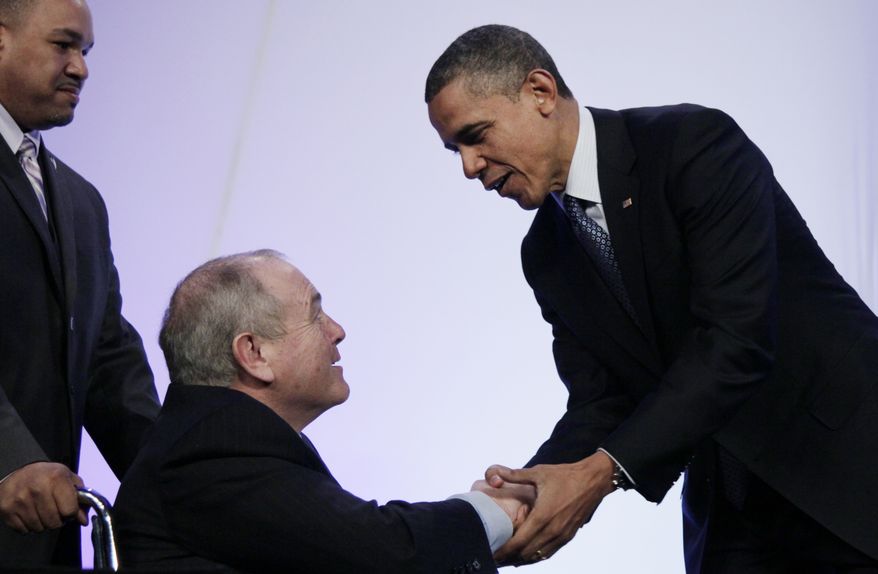 President Obama shakes hands April 3, 2012, with Dean Singleton, the outgoing AP chairman of the board, after Singleton introduced him to speak at the Associated Press luncheon during the ASNE Convention in Washington. (Associated Press)