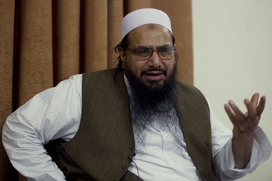 Hafiz Mohammad Saeed, chief of Jamaat-ud-Dawwa and founder of Lashkar-e-Taiba, talks with the Associated Press in Islamabad, Pakistan, on Tuesday, April 3, 2012. The United States has offered a $10 million bounty for the Pakistani militant leader, who allegedly orchestrated the 2008 Mumbai attacks and has been directing an anti-American political movement in recent months. (AP Photo/B.K. Bangash)