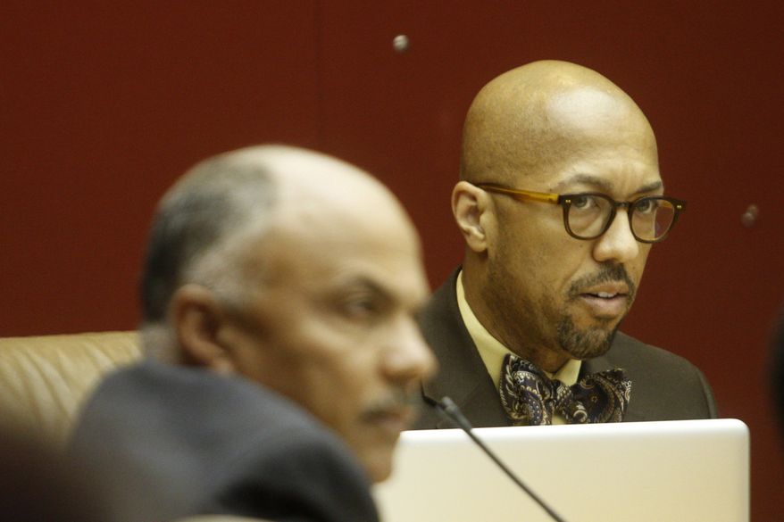 Detroit City Council President Charles Pugh responds during the open public forum during a Detroit City Council meeting discussing the city consent agreement on Wednesday, April, 4, 2012. The city of Detroit was moving closer to avoiding a state-appointed emergency manager Wednesday. A state-appointed review team approved an agreement between the state and city to fix Detroit's troubled finances. (AP Photo/Detroit Free Press, Jarrad Henderson)
