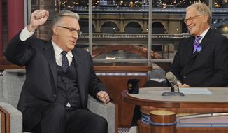 In this photo provided by CBS, talk show host Keith Olbermann, left, chats with host David Letterman on the set of the “Late Show with David Letterman,” Tuesday April 3, 2012 in New York. (AP Photo/CBS, Jeffrey R. Staab) 