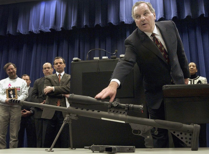 ** FILE ** Richard M. Daley, then the mayor of Chicago, points to a .50-caliber assault weapon during a news conference in 2005. (AP Photo/M. Spencer Green)