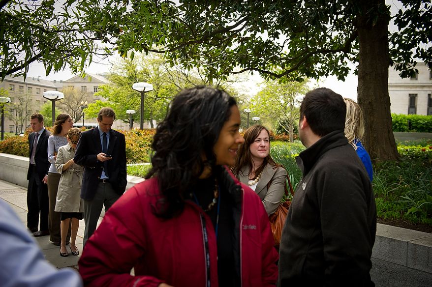 A constant line of people wait for the chance to order food at the Feelin' Crabby? food truck, parked near the corner of Virginia Avenue 20th Street NW and in Washington, D.C., Wednesday, April 4, 2012. (Rod Lamkey Jr/The Washington Times)