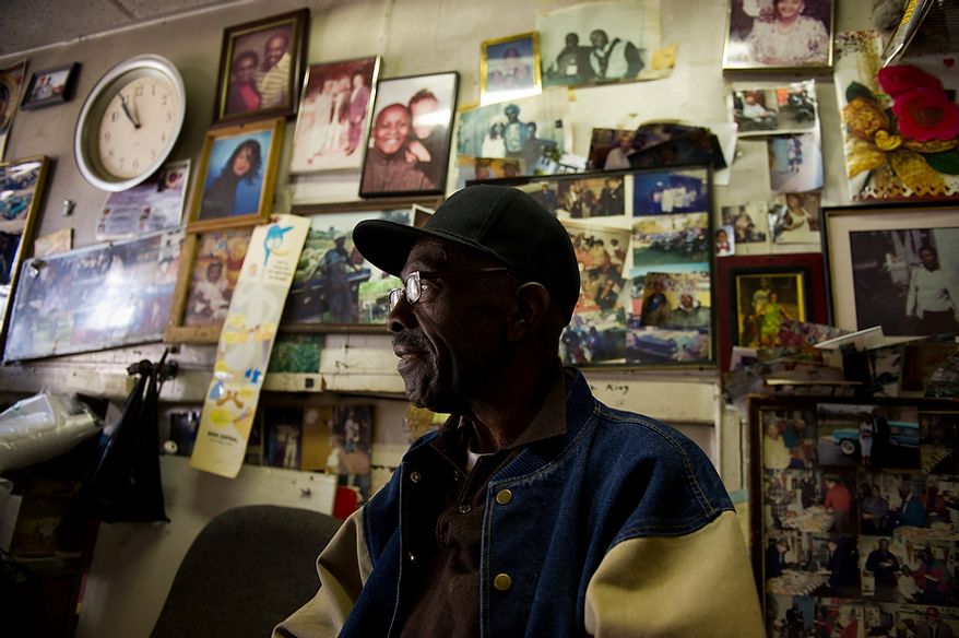 James Patterson, who has run a home improvement business next door to the Howard Theatre for 44 years and worked for the theatre from 1961 until it closed its doors sits in his office surrounded by photographs of friends and family, Washington, D.C., Thursday, April 5, 2012. The redesigned historic Howard Theatre is set to reopens with a ribbon cutting Monday and an opening night gala on Thursday. (Andrew Harnik/The Washington Times)