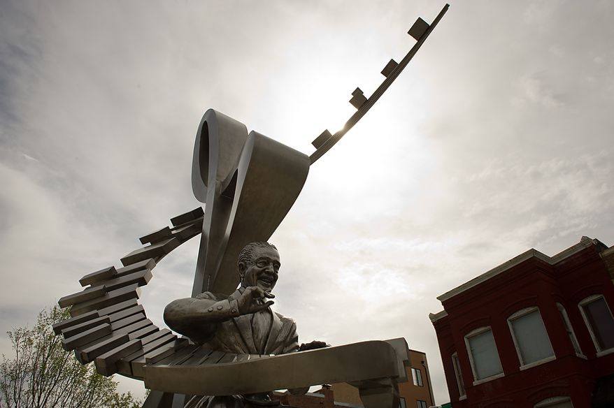 A newly installed stainless steel statue of D.C. native and jazz legend Duke Ellington sits in front of the redesigned historic Howard Theatre which is set to reopen with a ribbon cutting Monday and an opening night gala on Thursday, Washington, D.C., Thursday, April 5, 2012. (Andrew Harnik/The Washington Times)