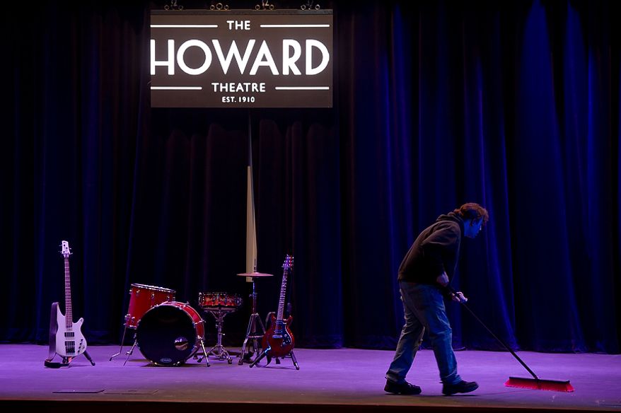 A worker sweeps the stage of the redesigned historic Howard Theatre which is set to reopen with a ribbon cutting Monday and an opening night gala on Thursday, Washington, D.C., Thursday, April 5, 2012. (Andrew Harnik/The Washington Times)