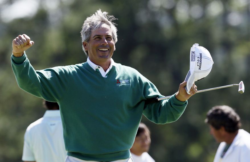 Fred Couples celebrates after finishing the second round the Masters tournament Friday, April 6, 2012, in Augusta, Ga. (AP Photo/David J. Phillip)