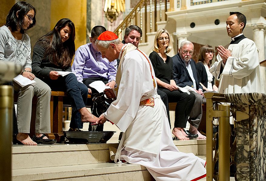 Cardinal Donald Wuerl, archbishop of Washington, washes the feet of 12 parishioners, including Bethzi Martinez during the Mass of the Lord's Supper at the Cathedral of St. Matthew the Apostle in Washington, D.C. on Holy Thursday, April 5, 2012. The washing of the feet is a religious rite that represents Jesus washing his disciples' feet, saying "A servant is no greater than his master." (Barbara L. Salisbury/The Washington Times)