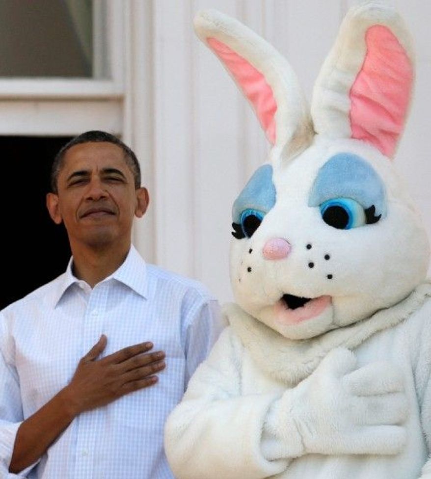 President Obama and the Easter Bunny stand for the National Anthem to kick off Monday's annual Easter Egg Roll at the White House. (Associated Press)