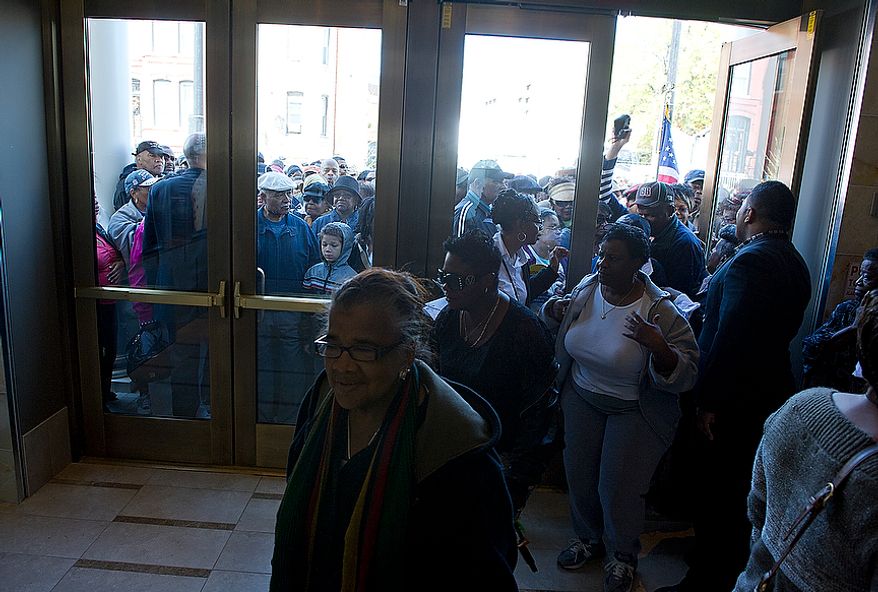 Crowds wait outside to come in and get a tour of the newly renovated Howard Theatre in Washington, D.C. on Monday, April 9, 2012. The theater, which originally opened in 1910, was one of the first places African-Americans could see live musical acts. Performers such as Duke Ellington, Chuck Berry, Marvin Gaye and Diana Ross all played here. (Barbara L. Salisbury/The Washington Times)