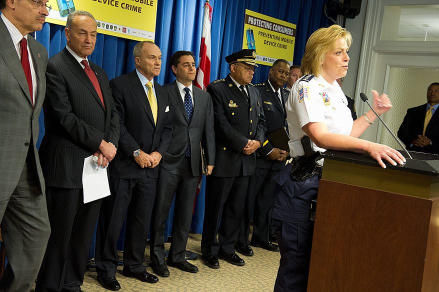 D.C. Police Chief Cathy L. Lanier and political and law enforcement leaders from several cities were present for the announcement Tuesday of the anti-smartphone theft initiative at the District's John A. Wilson Building. Attending were (from left) D.C. Mayor Vincent C. Gray, Sen. Charles Schumer, New York Democrat, New York Police Commissioner Raymond Kelly, FCC Chairman Julius Genachowski, Philadelphia Police Commissioner Charles H. Ramsey and Metro Transit Police Department Chief Michael Taborn. (Barbara L. Salisbury/The Washington Times)