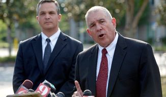 Hal Uhrig (right) and Craig Sonner withdrew as defense attorneys for George Zimmerman, the man who claims self-defense in the fatal shooting of black teenager Trayvon Martin in Sanford, Fla. &quot;We&#39;re concerned for his emotional and physical safety,&quot; Mr. Uhrig said at a Tuesday news conference, saying that their client had cut off all contact and that he had left the state. (Associated Press)