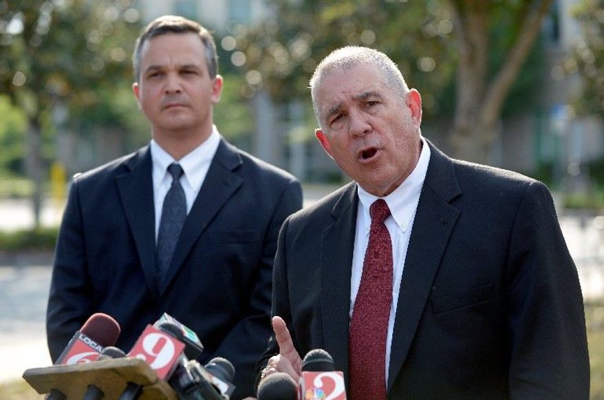 Hal Uhrig (right) and Craig Sonner withdrew as defense attorneys for George Zimmerman, the man who claims self-defense in the fatal shooting of black teenager Trayvon Martin in Sanford, Fla. "We're concerned for his emotional and physical safety," Mr. Uhrig said at a Tuesday news conference, saying that their client had cut off all contact and that he had left the state. (Associated Press)