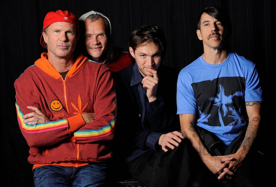The Red Hot Chili Peppers (from left) drummer Chad Smith, bassist Flea, guitarist Josh Klinghoffer and singer Anthony Kiedis will play at this year's Lollapalooza music festival in Chicago. (Associated Press)