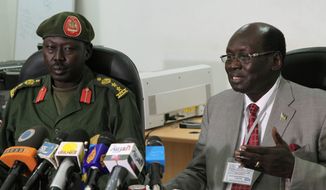 **FILE** Barnaba Benjamin Marial (right), the South Sudanese minister of information, and military spokesman Philip Aguer brief the media on March 27, 2012, in Juba, South Sudan, about recent fighting between Sudanese and South Sudanese forces along the north-south border. (Associated Press)