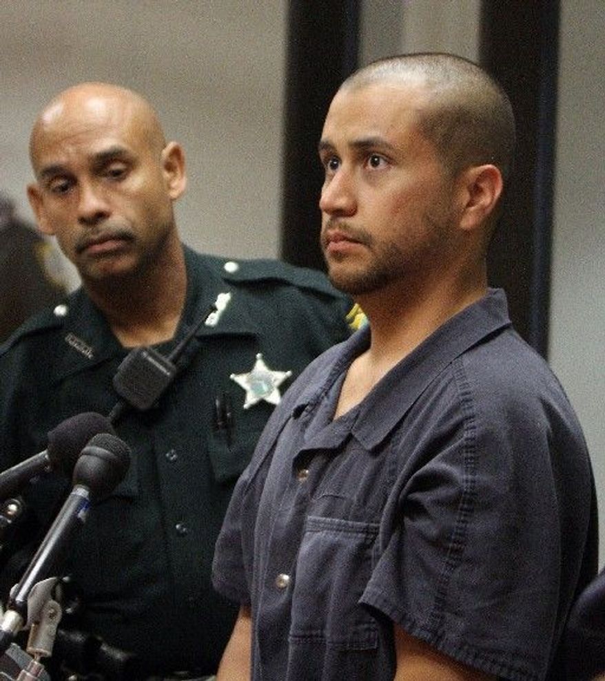 George Zimmerman stands with a Seminole County deputy during a court hearing Thursday in Sanford, Fla. He is charged with second-degree murder in the shooting death of 17-year-old Trayvon Martin. He acknowledged only his presence. (Associated Press)