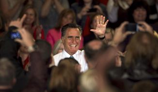 Republican presidential candidate and former Massachusetts Gov. Mitt Romney waves before addressing an audience April 11, 2012, during a campaign event in Warwick, R.I. (Associated Press)