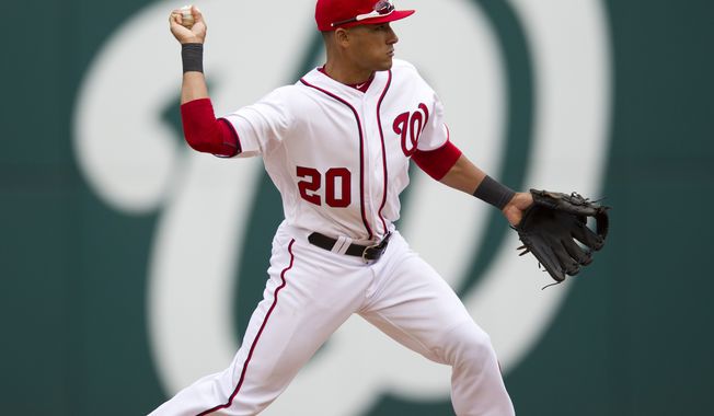 Washington Nationals shortstop Ian Desmond throws out a Cincinnati Reds runner during the ninth inning Thursday, April 12, 2012, in Washington. The Nationals won 3-2 in 10 innings. (AP Photo/Evan Vucci)