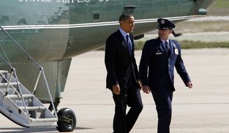 President Obama is escorted April 13, 2012, by Col. Kenneth R. Rizer, commander of the 11th Wing, upon his arrival at Andrews Air Force Base, Md., en route to Florida. (Associated Press)