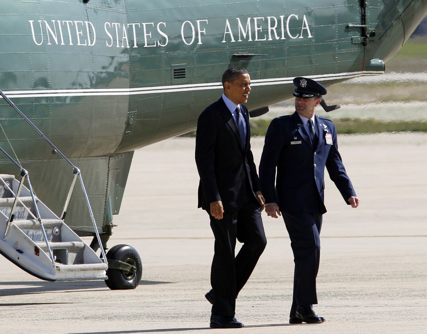 President Obama is escorted April 13, 2012, by Col. Kenneth R. Rizer, commander of the 11th Wing, upon his arrival at Andrews Air Force Base, Md., en route to Florida. (Associated Press)