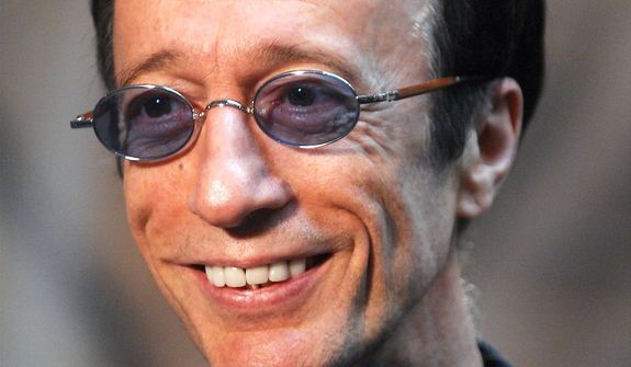 **FILE** Former Bee Gees singer Robin Gibb talks with journalists at the European Parliament in Brussels in April 2007. (Associated Press