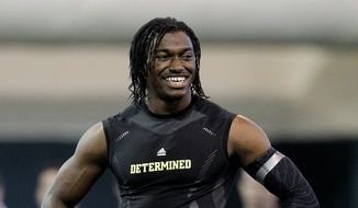 Heisman Trophy winner and former Baylor quarterback Robert Griffin III during Baylor pro day Wednesday, March 21, 2012, in Waco, Texas. (AP Photo/Tony Gutierrez)