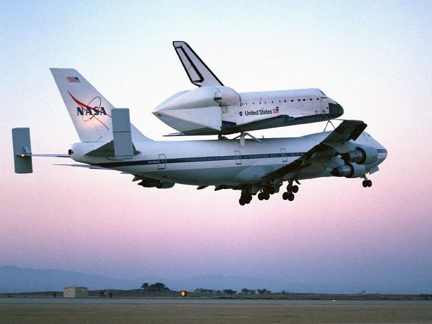 The space shuttle Discovery flies piggyback atop a modified Boeing 747 in an undated photo. It will take a similar ride, its last, along the Potomac on Tuesday morning on its way to the Smithsonian's Steven F. Udvar-Hazy Center near Washington Dulles International Airport. (Photograph provided by NASA)