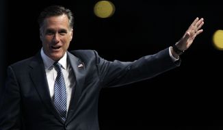 Republican presidential candidate and former Massachusetts Gov. Mitt Romney waves after speaking April 13, 2012, at the National Rifle Association convention in St. Louis. (Associated Press)