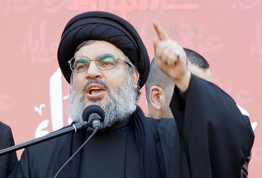 Hezbollah leader Sheik Hassan Nasrallah, speaks to the crowd in a rare public appearance during a rally to mark the Muslim holy day of Ashoura, in the Hezbollah stronghold of south Beirut, Lebanon, on Tuesday Dec. 6, 2011. Sheik Hassan Nasrallah has rarely been seen in public since his Shiite Muslim group battled Israel in a monthlong war in 2006, fearing Israeli assassination. Since then, he has communicated with his followers and gives news conference mostly via satellite link. Ashoura marks the anniversary of the death in the seventh century of the Prophet Muhammad's grandson Imam Hussein. His death in a battle outside of the Iraqi city of Karbala sealed Islam's historical Sunni-Shiite split, which still bedevils the Middle East. Ashoura is one of the holiest days of the Muslim Shiite calendar. (AP Photo/Bilal Hussein)