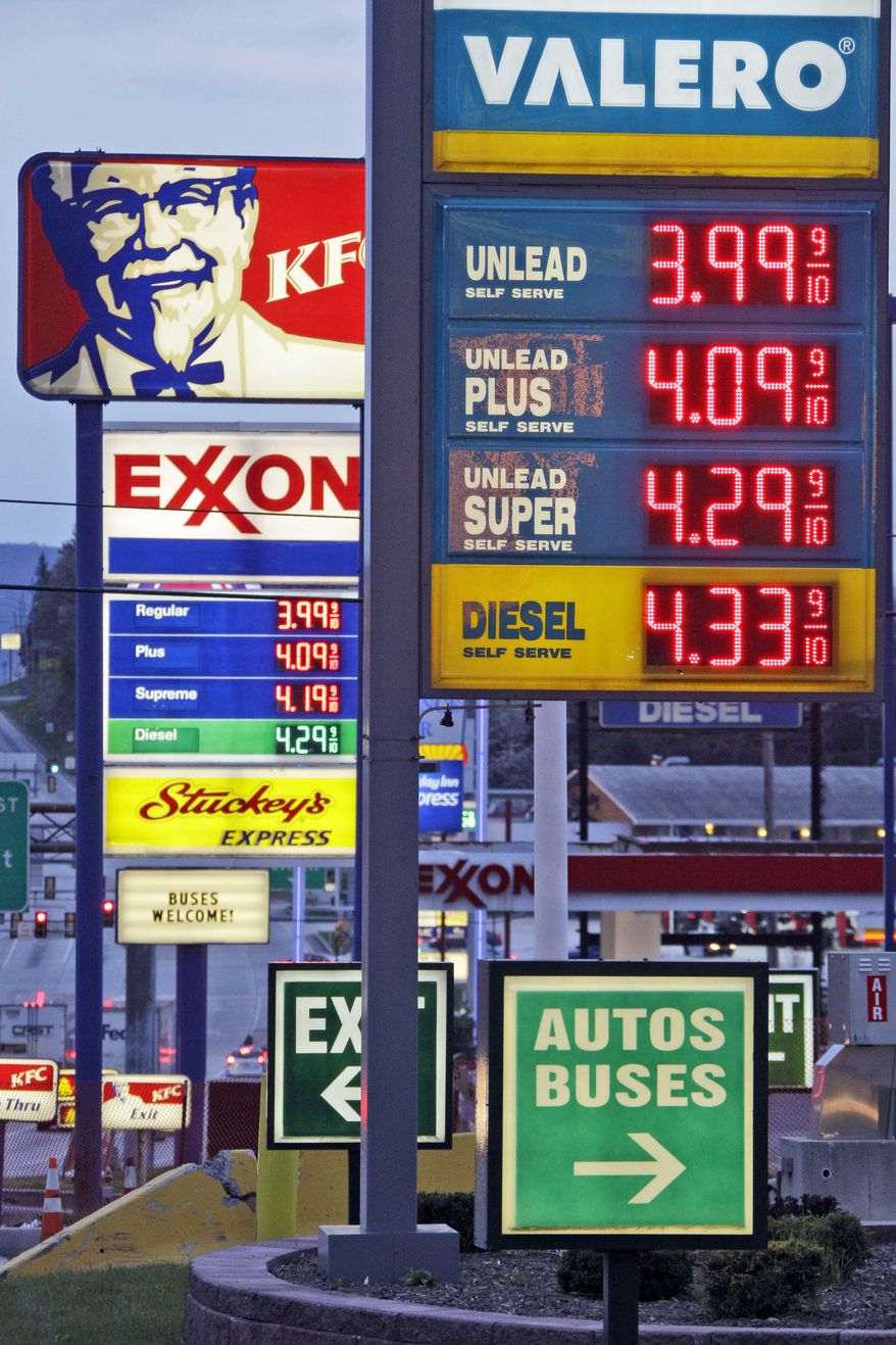 Gas prices are posted at gas stations in Breezewood, Pa., Monday, April 9, 2012. (AP Photo/Gene J. Puskar)