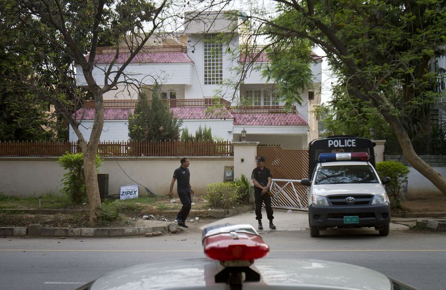 Police commandos stand guard on Tuesday, April 17, 2012, outside a house in Islamabad, Pakistan, where family members of the late al Qaeda leader Osama Bin Laden are believed to be held. (AP Photo/Anjum Naveed)