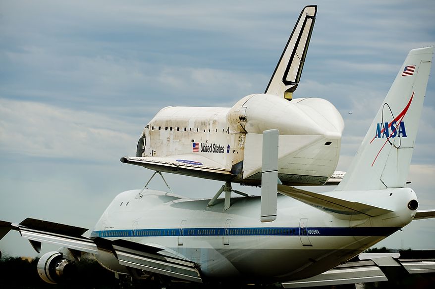 The space shuttle Discovery arrives by 747 carrier aircraft at Washington Dulles International Airport, Chantilly, Va., Tuesday, April 17, 2012. After completing 39 missions and spending 365 days in space, the historic spacecraft will make its final destination at the Steven F. Udvar-Hazy Center, a Smithsonian museum, located in Chantilly, Va. on Thursday, April 19th. (Andrew Harnik/The Washington Times)
