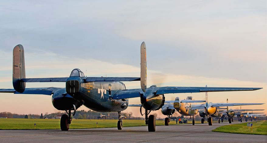 B-25 bombers from across the country line up Tuesday at Grimes Field Airport in Urbana, Ohio. The planes were on their way to Ohio's Wright-Patterson Air Force Base to celebrate the 70th anniversary of Doolittle's Tokyo Raid. (Andrew S. Geraci/The Washington Times)
