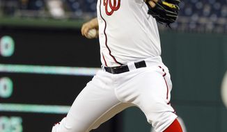Washington Nationals starting pitcher Jordan Zimmermann delivers to the Houston Astros during the first inning in Washington on Wednesday, April 18, 2012. (AP Photo/Ann Heisenfelt)
