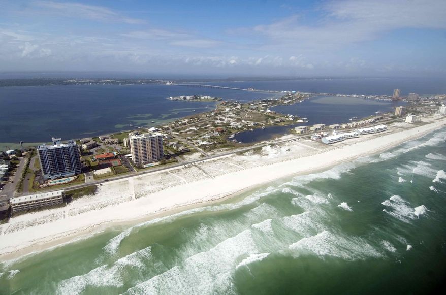 An aerial photo taken Monday April 16, 2012, shows the coast of Pensacola Beach, Fla., during a media helicopter flight organized by the BP Gulf Coast Restoration Organization. (AP Photo/Northwest Florida Daily News, Devon Ravine)