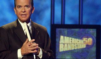 **FILE** Dick Clark, host of the American Bandstand television show, introduces entertainer Michael Jackson on stage April 20, 2002, during taping of the show&#39;s 50th anniversary special in Pasadena, Calif. (Associated Press)