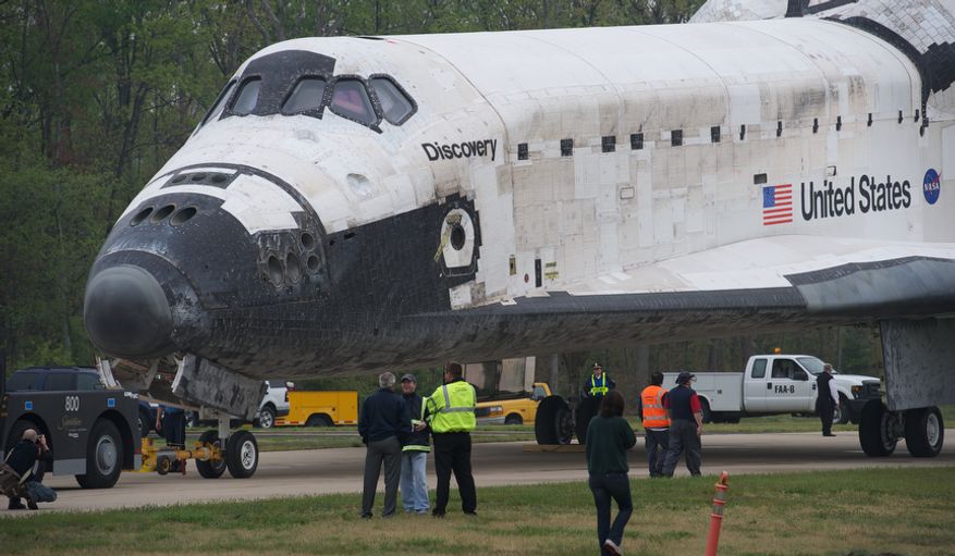 The NASA Space Shuttle Discovery sits on a road prior to a welcoming ceremony at the Smithsonian&#39;s National Air and Space Museum annex in Chantilly, Va., on April 19, 2012. (Rod Lamkey Jr./The Washington Times)