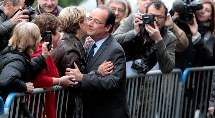 French presidential candidate Francois Hollande of the Socialist Party campaigns in Tulle on election day. (Associated Press)